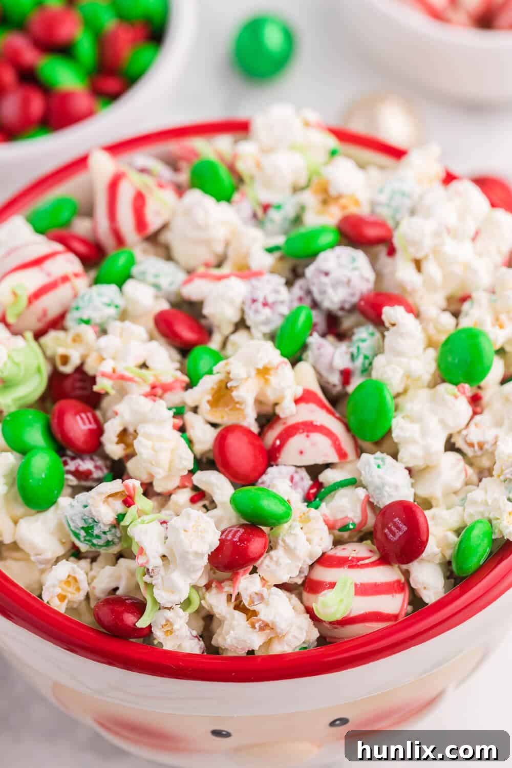 The Christmas popcorn displayed in a charming festive Santa serving bowl, perfect for holiday gatherings.