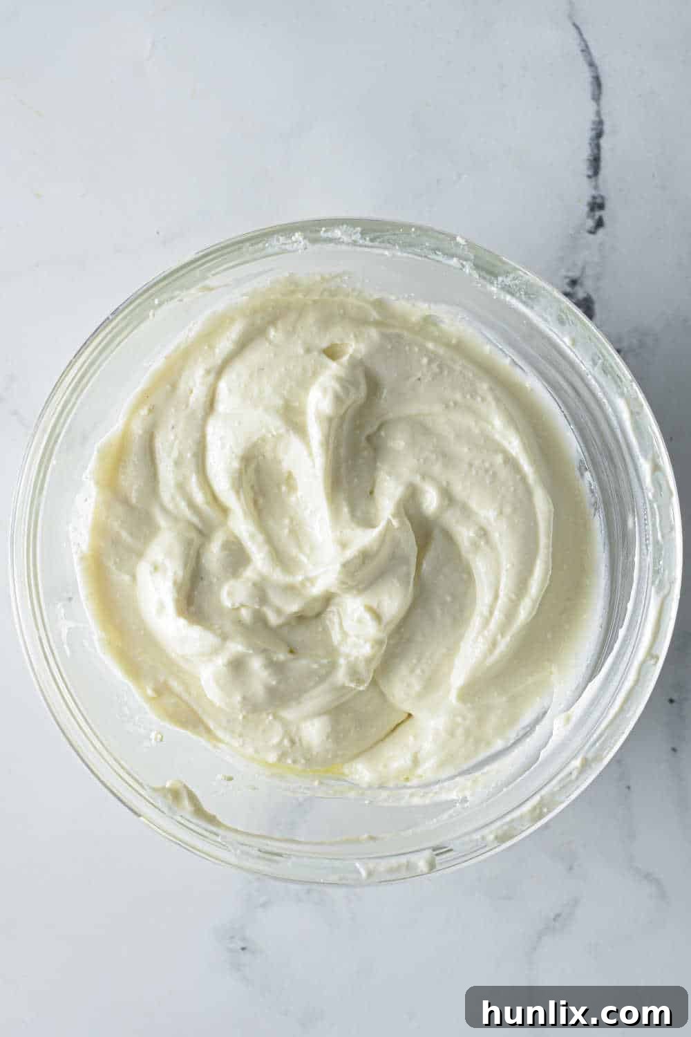 Air Fried Pasta Crisps 7 A collage showing feta cheese, Greek yogurt, garlic, and olive oil being mixed in a food processor to create the creamy dip.