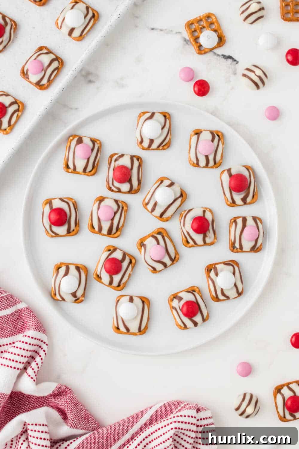 A vibrant display of finished Pretzel Hugs on a white plate, ready to be enjoyed.