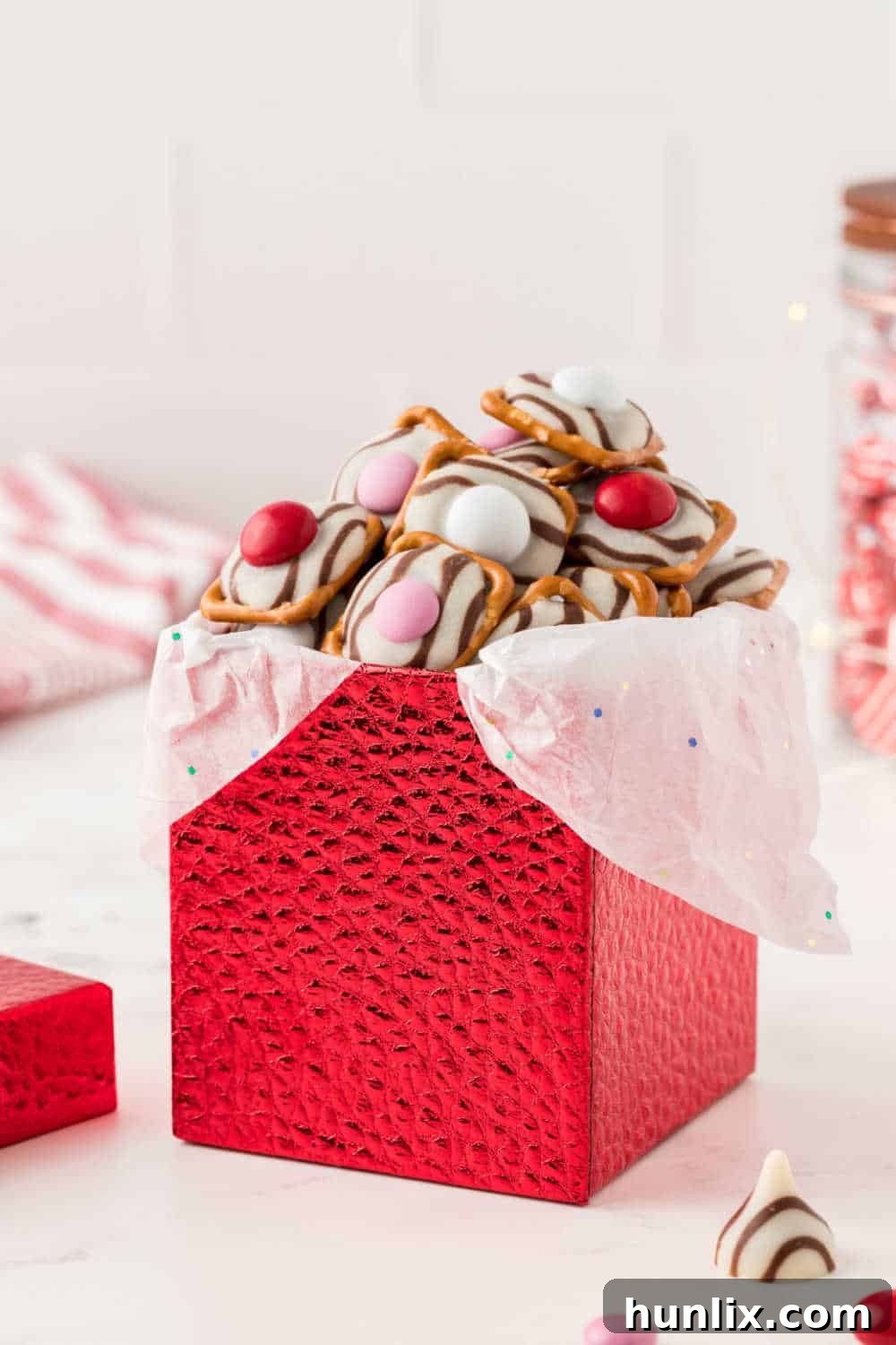 Pretzel Hugs neatly arranged in a festive red box, suggesting they are perfect for gifting.