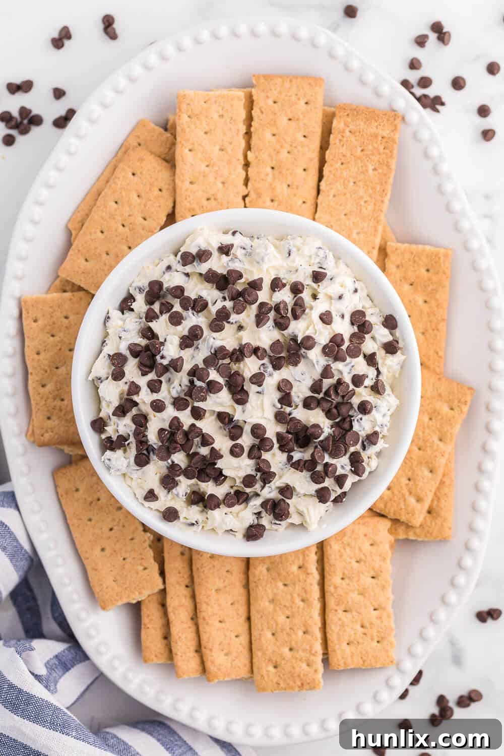 Booty dip on a platter surrounded by golden graham crackers, ready to be served.
