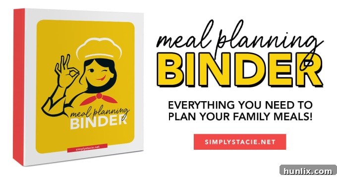 Effortless Instant Pot Strawberry Jam 3 A collection of kitchen tools including an Instant Pot, a measuring cup, and a wooden spoon, laid out on a clean counter.