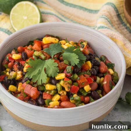 A vibrant bowl of Cowboy Caviar, illustrating its colorful and fresh ingredients.