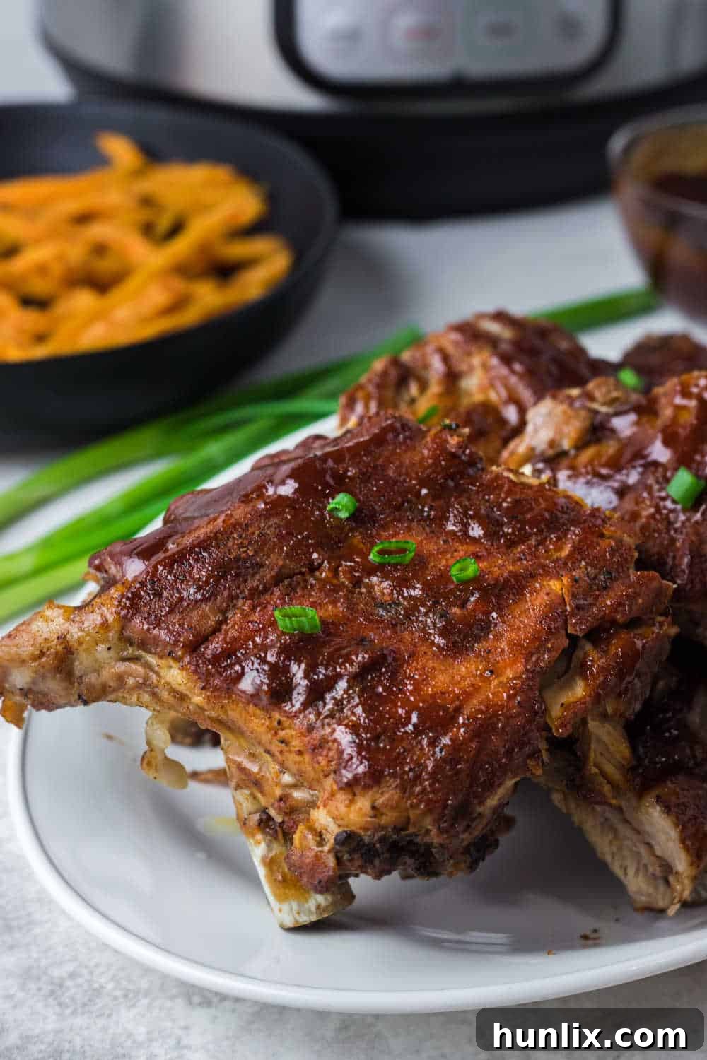 Fall-Off-The-Bone Instant Pot BBQ Ribs 9 Instant Pot BBQ Pork Ribs on a plate.