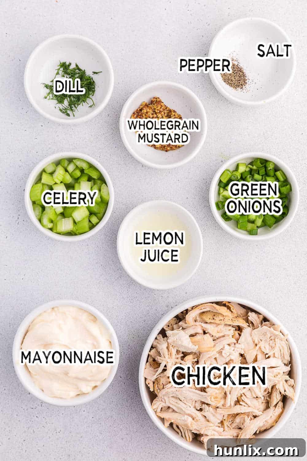Creamy Homestyle Chicken Salad 3 Ingredients laid out on a board for making classic chicken salad.