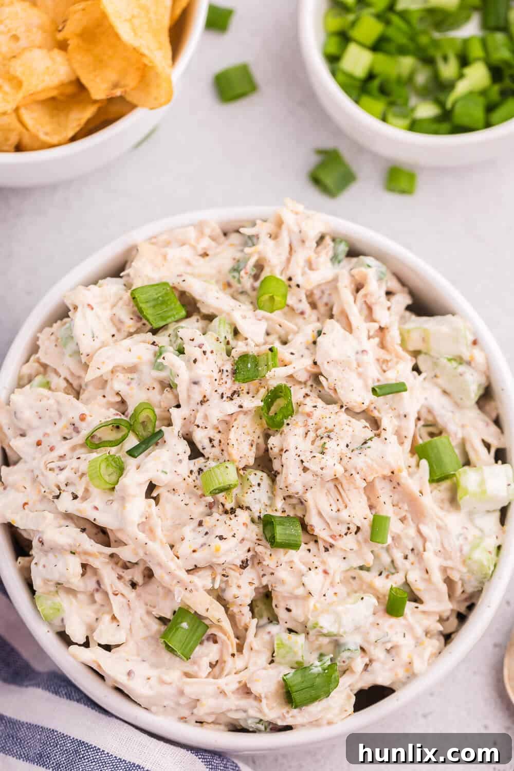 Creamy Homestyle Chicken Salad 7 A bowl of classic chicken salad, served with fresh ingredients.