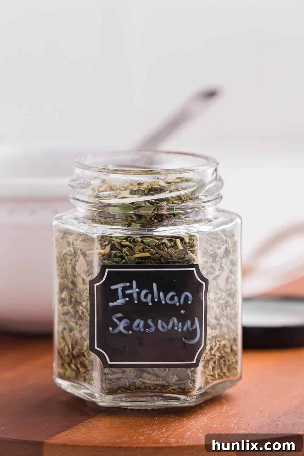 Close-up of Italian seasoning in a glass jar, demonstrating proper storage.