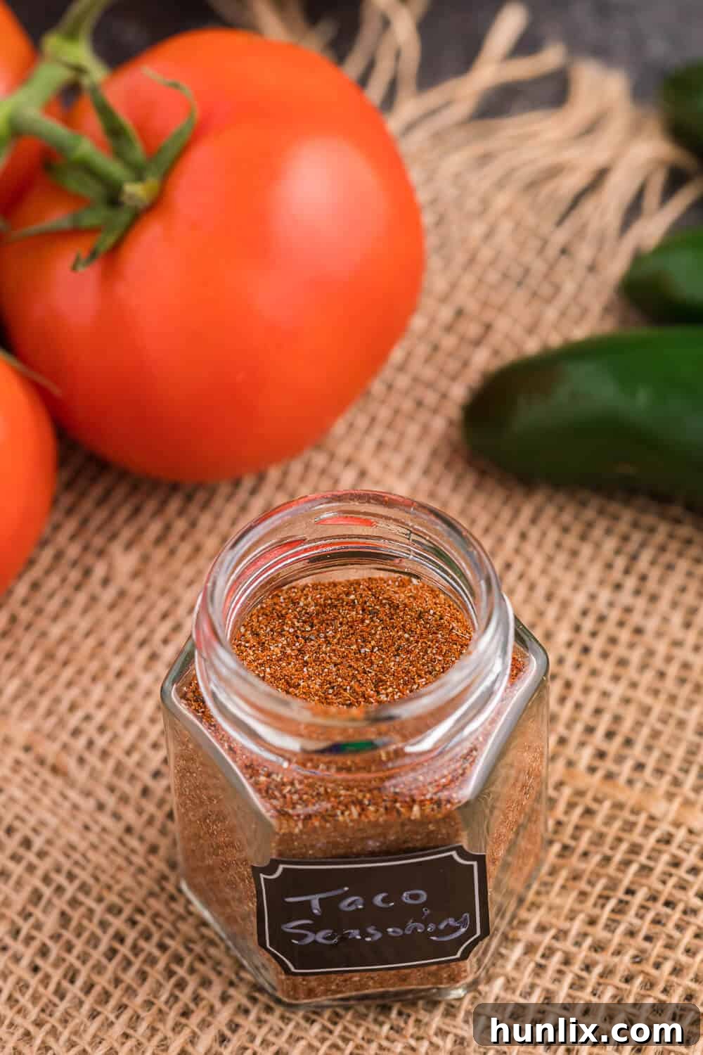 Taco seasoning neatly stored in a clear spice jar, ready for use.