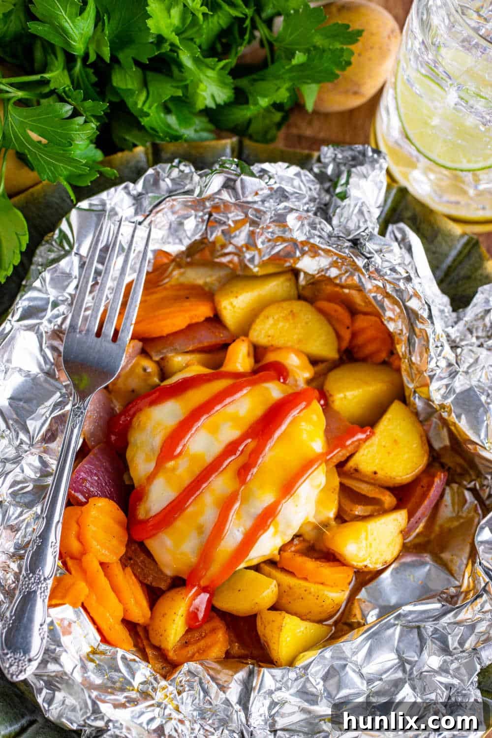 Fireside Burger Pockets 8 Burger Hobo Packets with a fork.