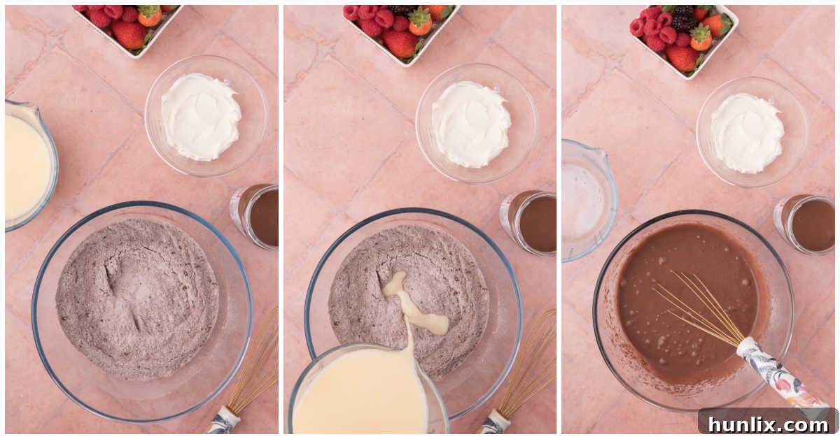 Pure Chocolate Waffle Bliss 6 The final stage of mixing chocolate waffle batter, showing wet ingredients being slowly incorporated into dry ingredients.