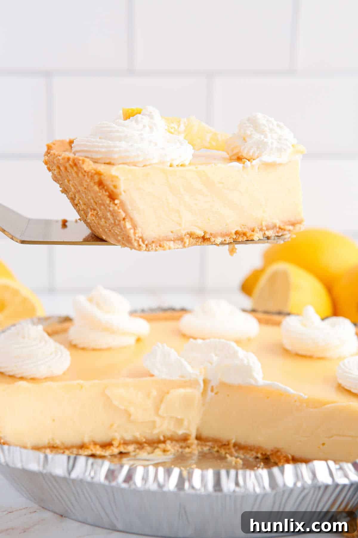 Classic lemon pie slice on a pie server.