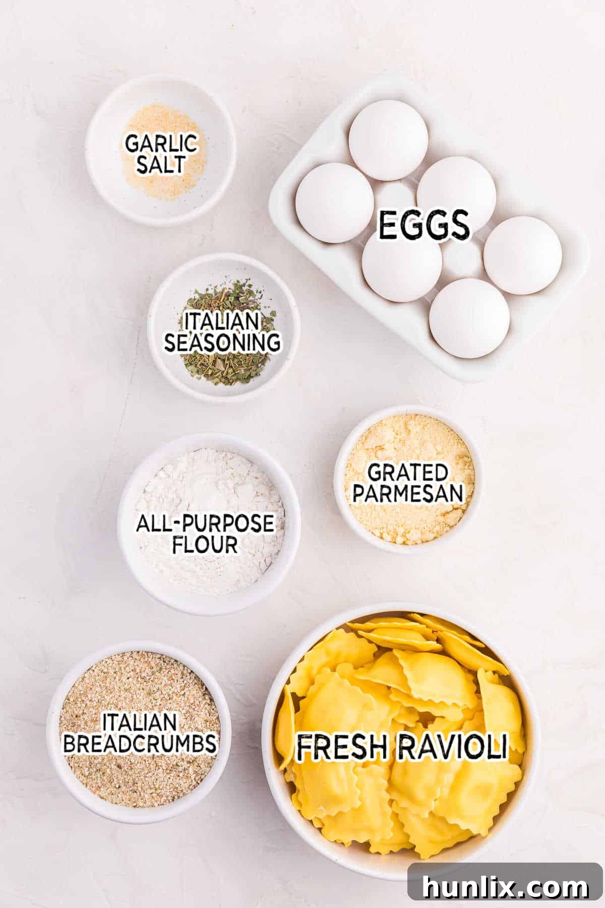 Golden Air Fryer Ravioli 3 Ingredients on a white surface.