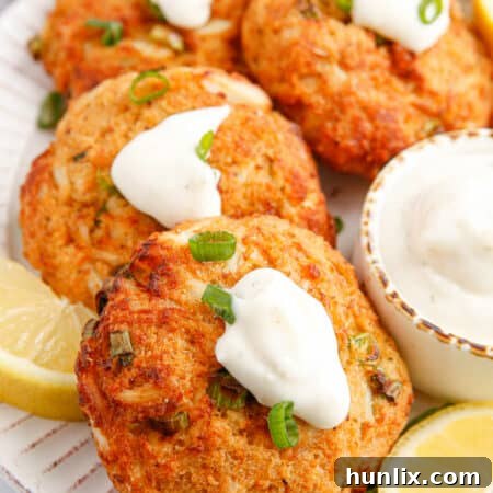 Delicious Air Fryer Crab Cakes served with lemon and tartar sauce.