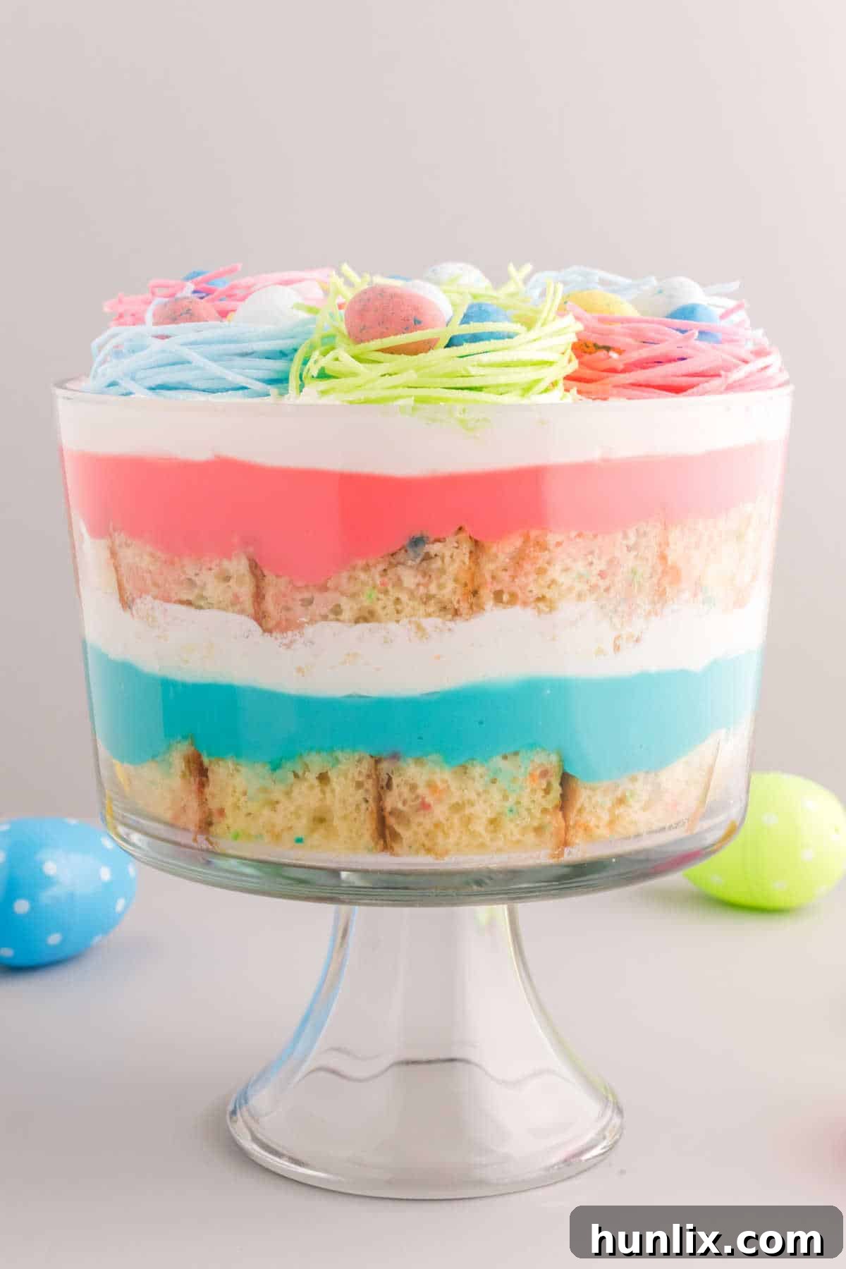 A close-up view of the Easter Trifle in a trifle dish, highlighting its layered beauty.