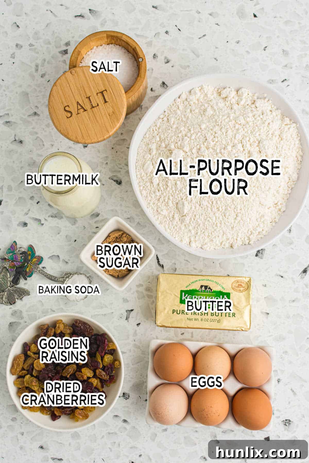 A beautiful flat lay of all the essential ingredients artfully arranged on a marbled counter, ready for baking.