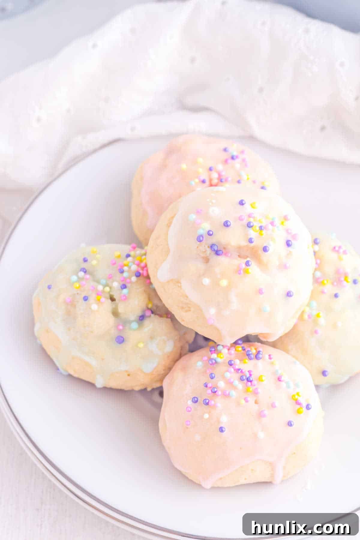 Sweet Italian Easter Delights 10 Italian Easter Cookies beautifully arranged on a white serving plate, highlighting their vibrant colors.