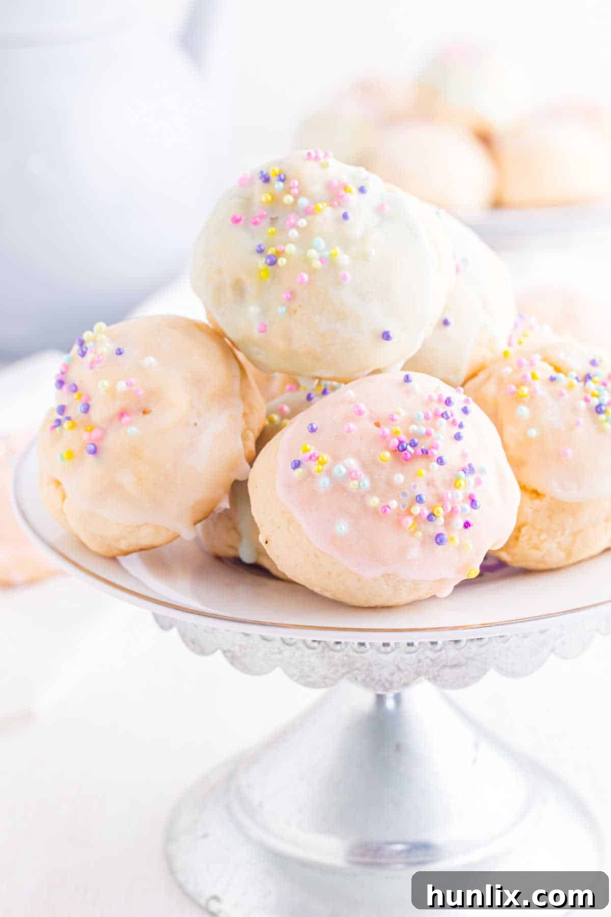 Sweet Italian Easter Delights 13 Italian Easter Cookies stacked on a decorative stand, ready to be served.
