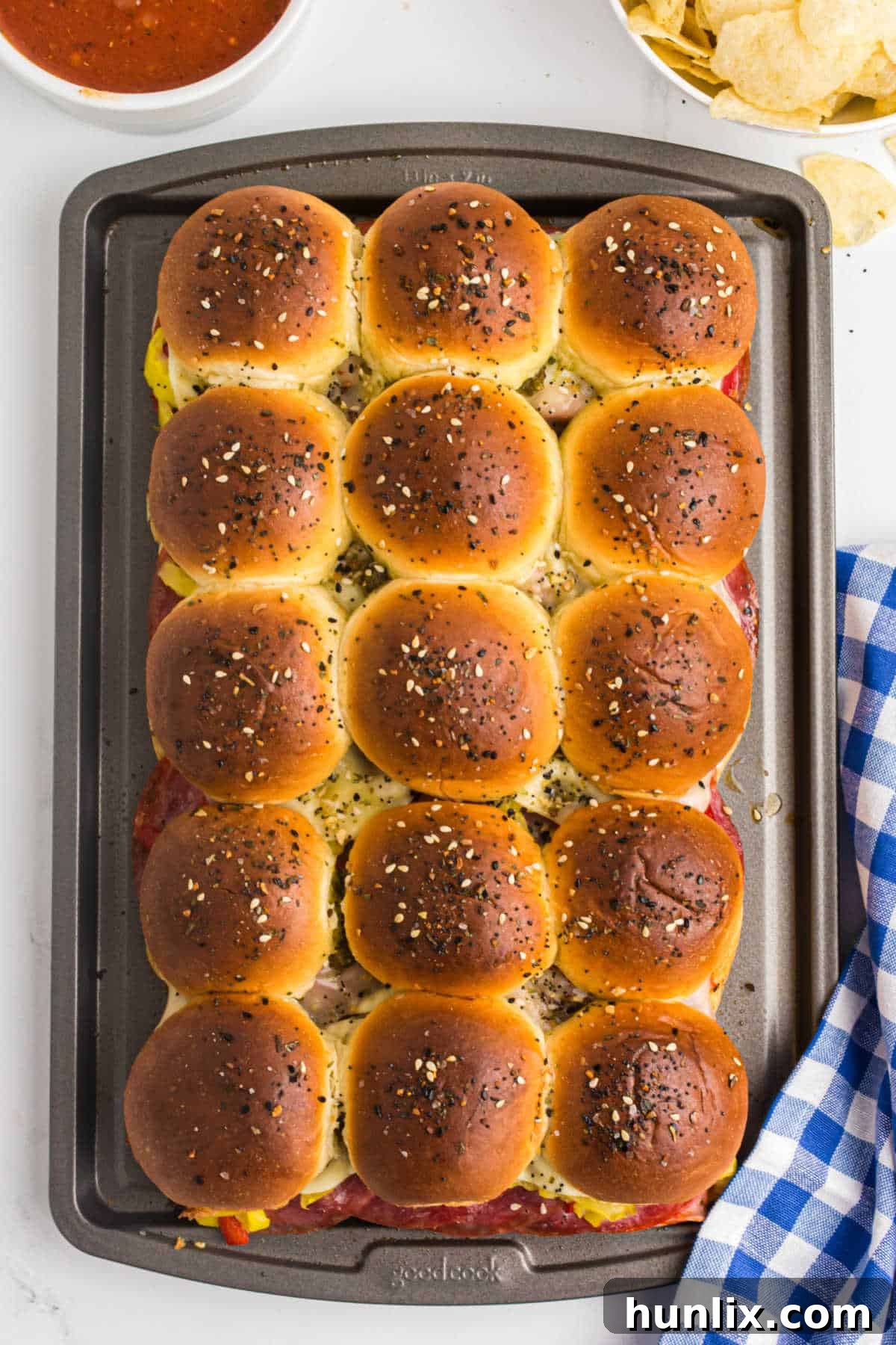 Italian sliders on a baking sheet, ready to be served as a delicious appetizer.