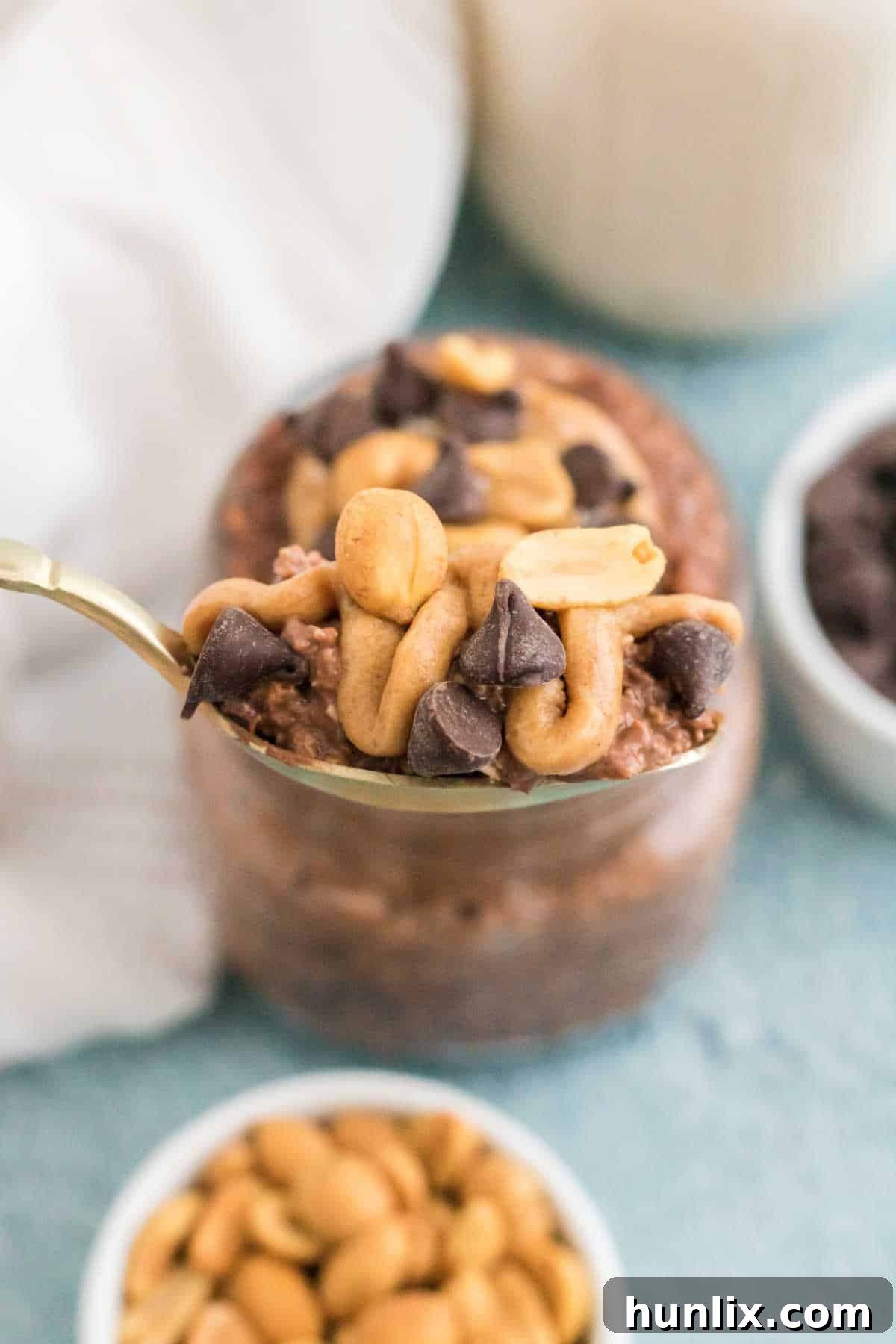Dreamy Chocolate Peanut Butter Overnight Oats 8 A spoonful of chocolate peanut butter overnight oats, showcasing its rich and creamy texture.