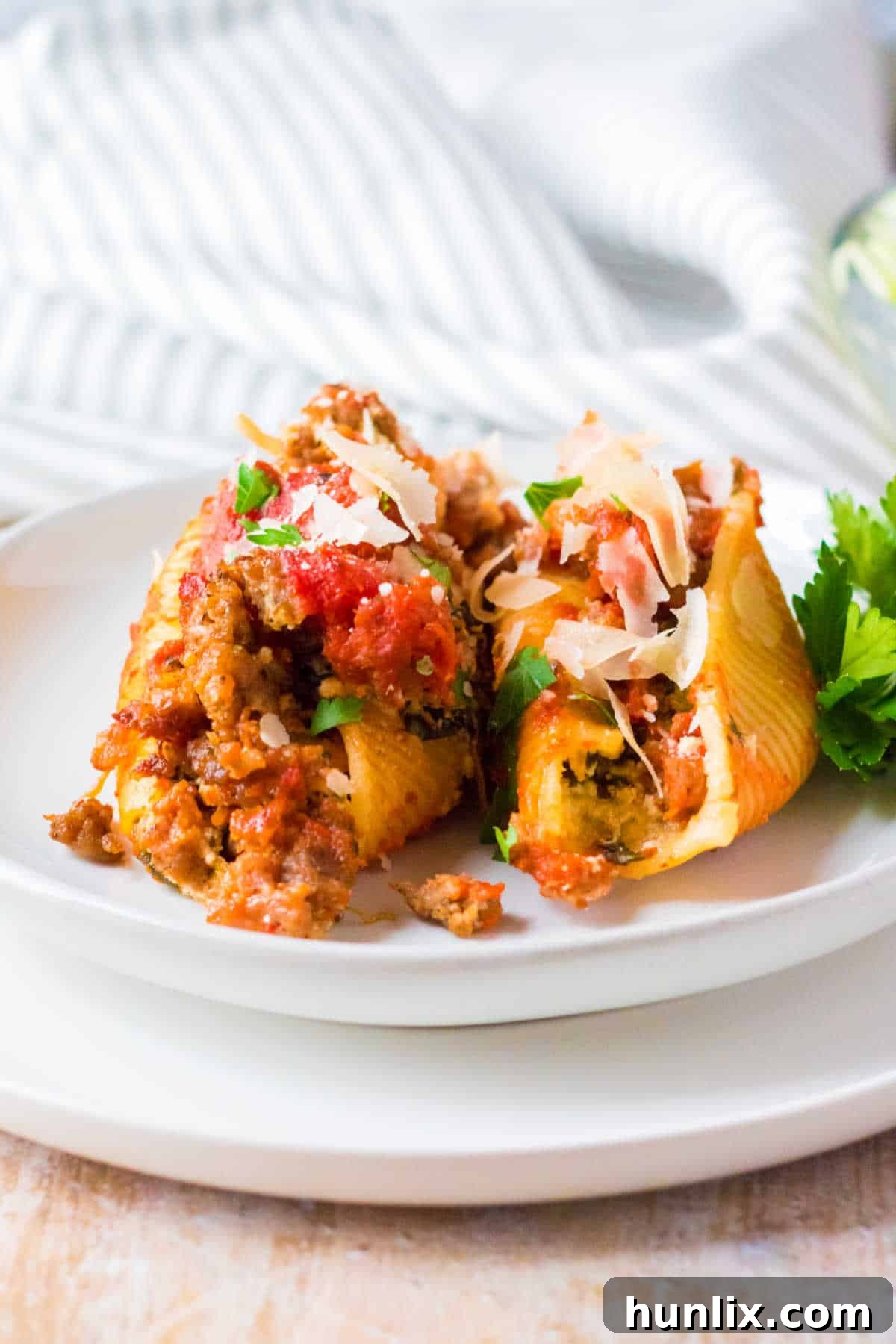 Stuffed shells served on a white plate.