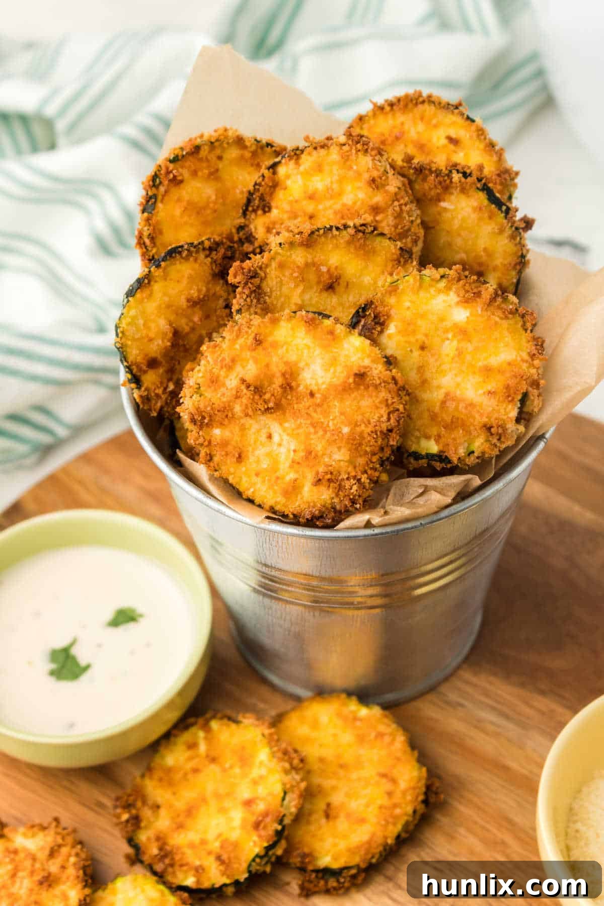Golden Crispy Air Fryer Zucchini 6 Air fryer zucchini chips served in a metal tin, ready to eat.