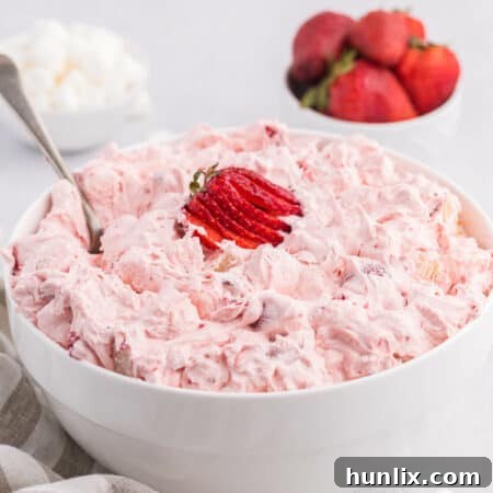 Strawberry Fluff Salad, garnished with fresh strawberries