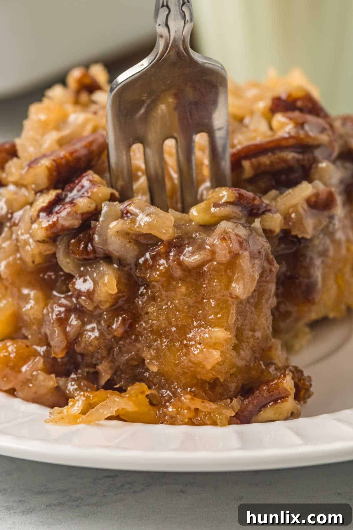A piece of Tornado Cake with a fork, showing its moist and tender interior.