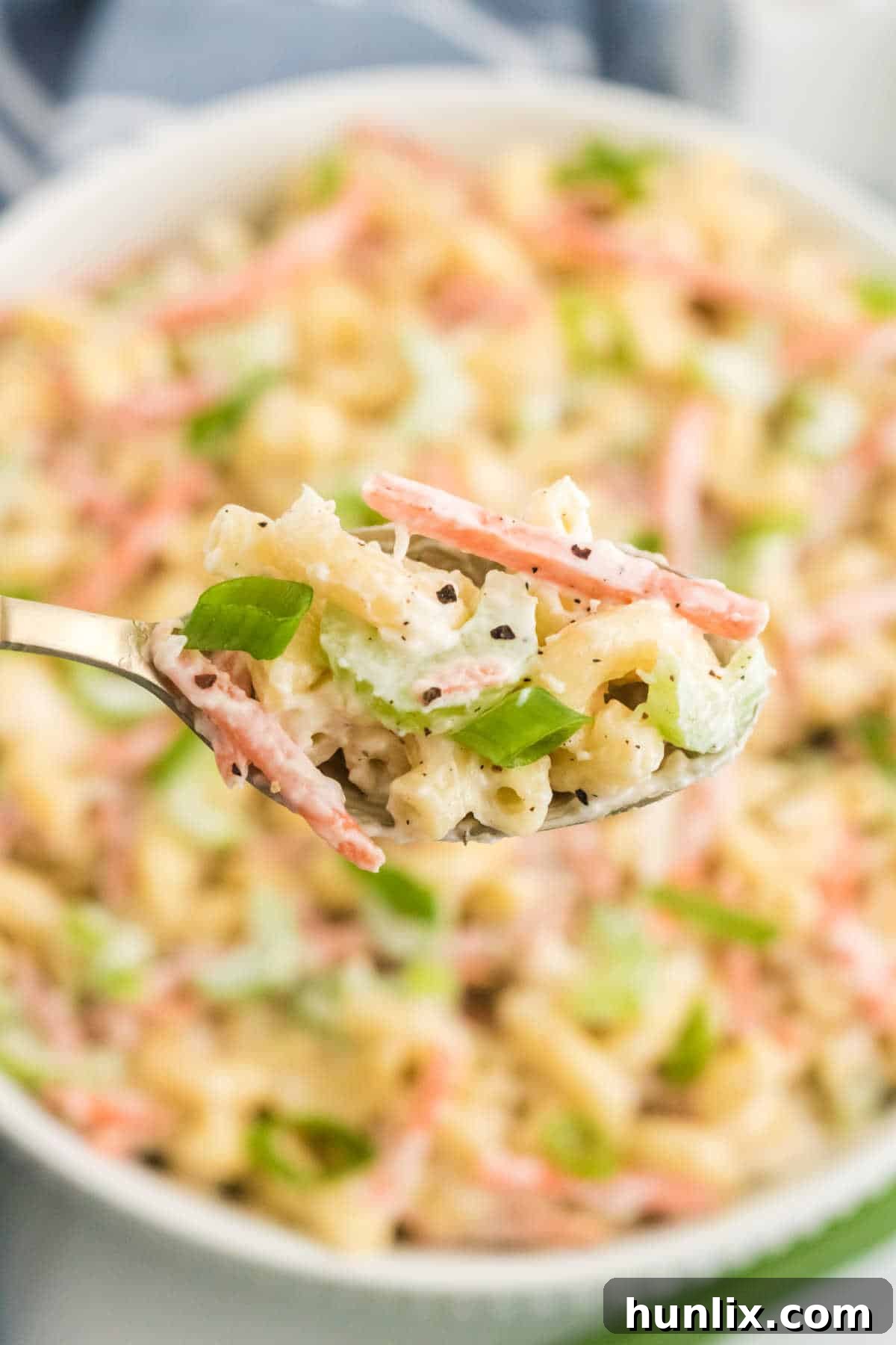 Hawaiian macaroni salad on a spoon.