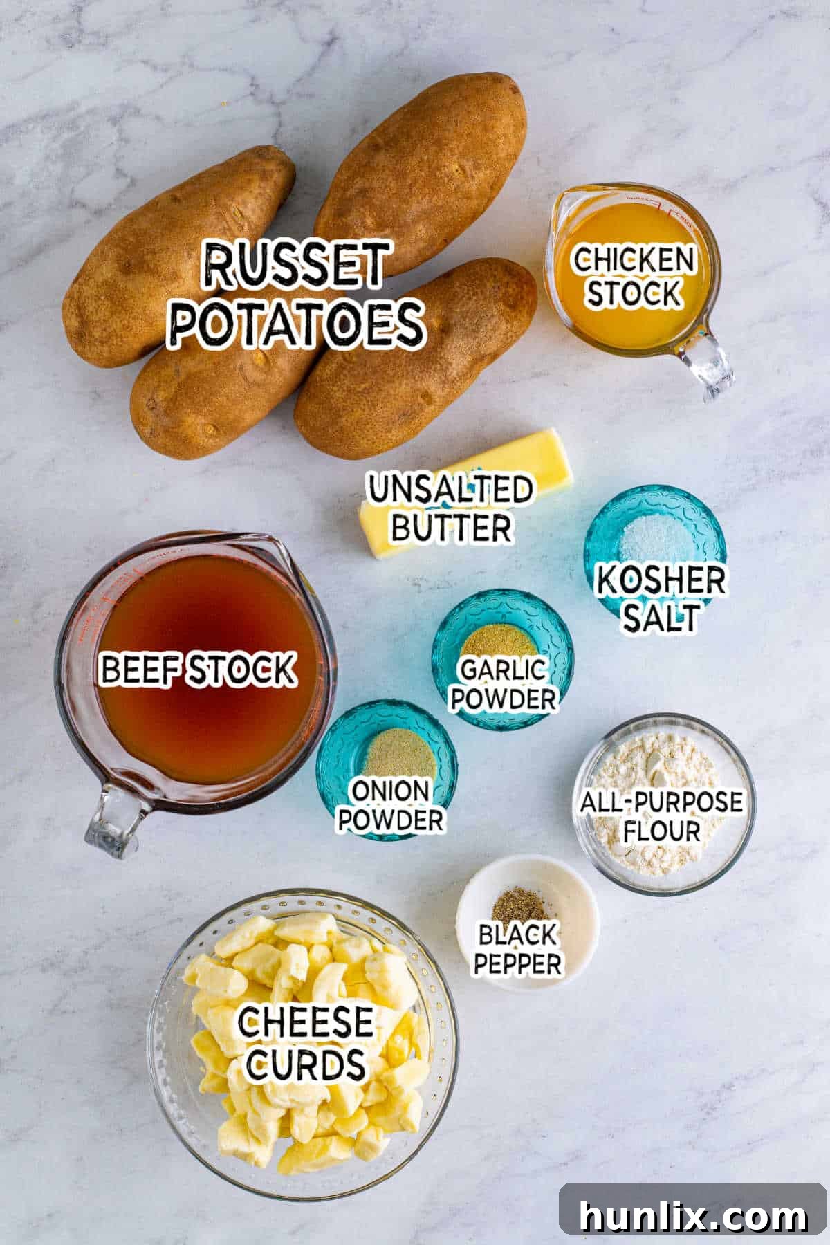 Canada's Iconic Comfort Food 3 Various ingredients laid out for making poutine, including potatoes, butter, flour, spices, and cheese curds.