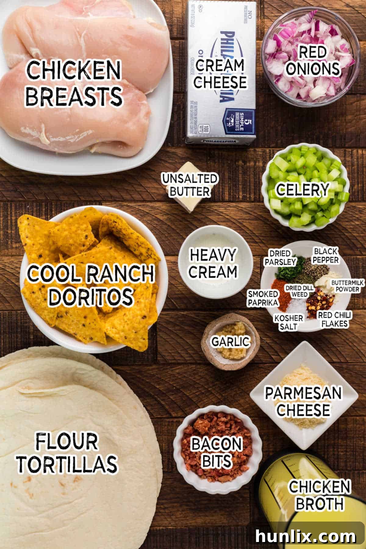 A collection of fresh ingredients laid out on a table, ready to be used for making chicken pinwheels.