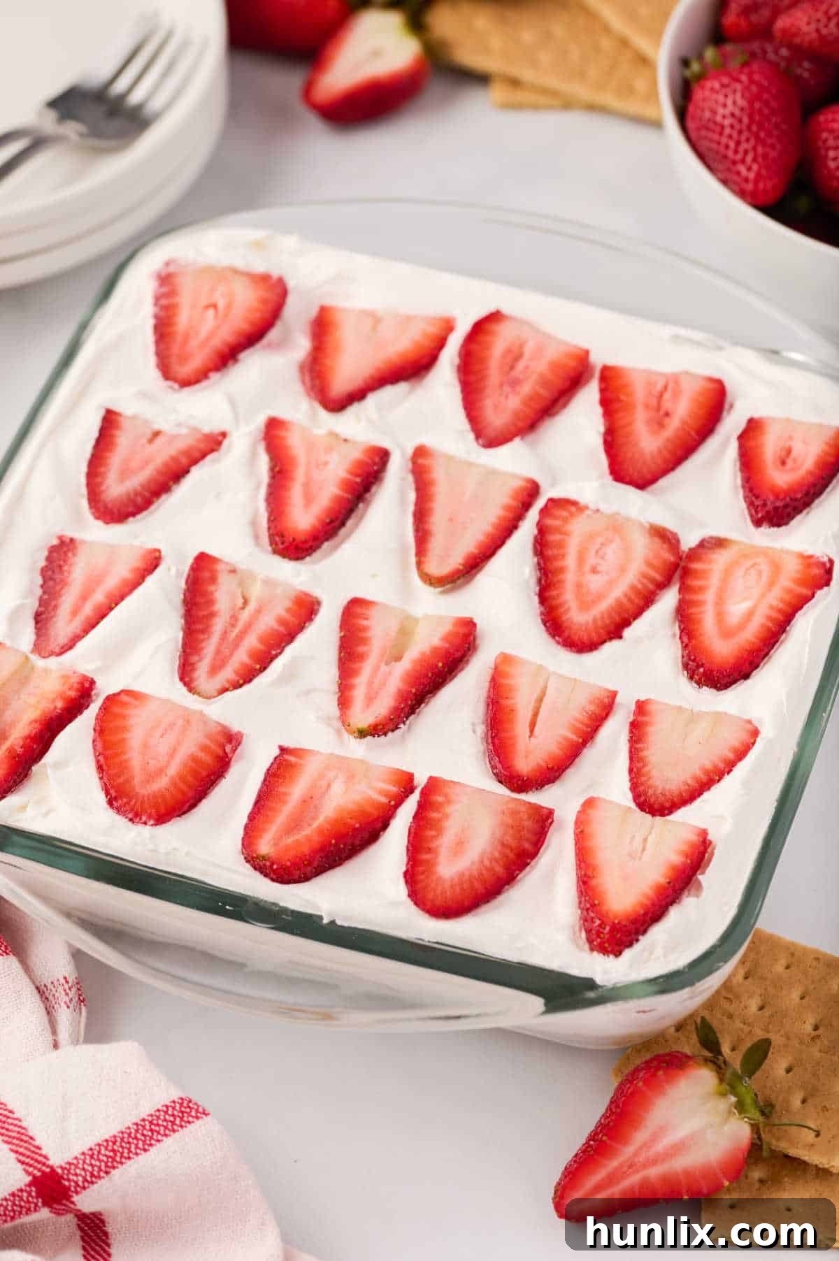 A pan of strawberry ice box cake, beautifully layered and ready to serve.