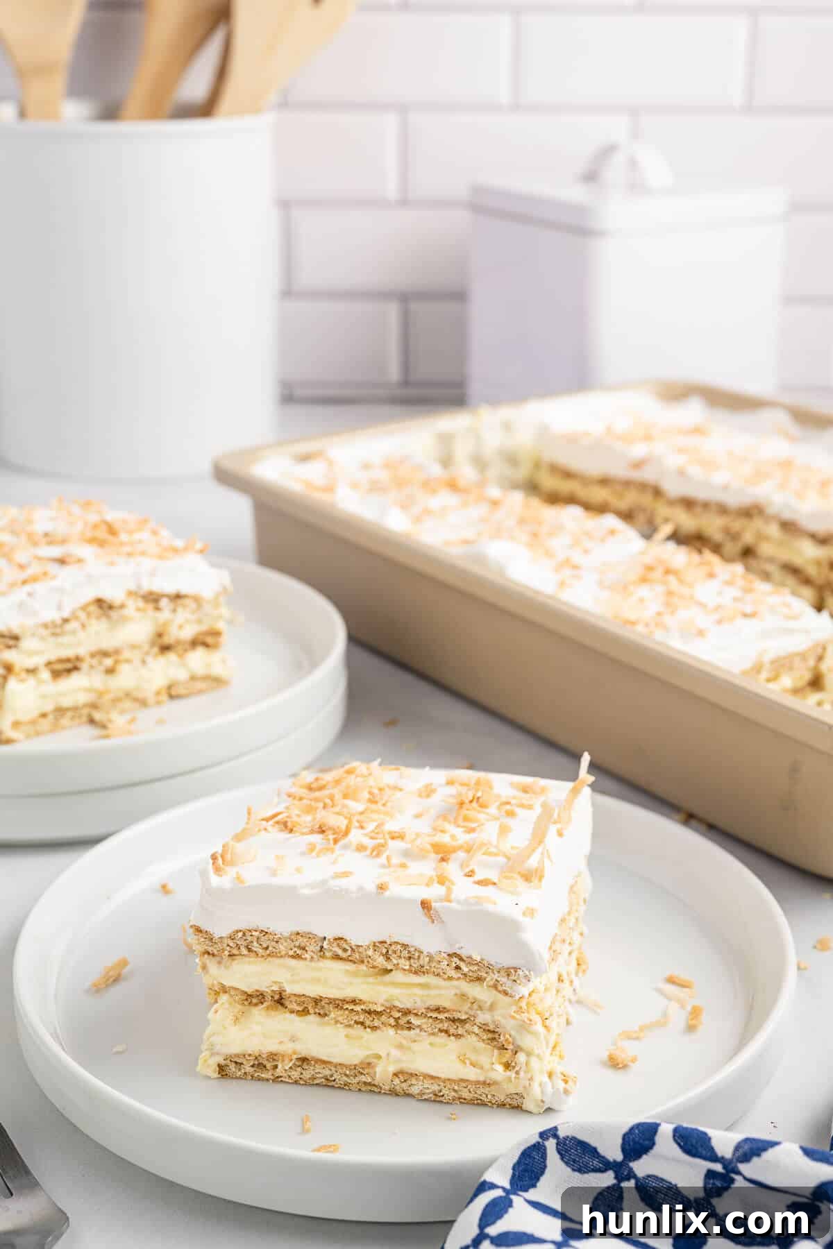 Creamy Coconut Chill Cake 11 A piece of cake on a plate.