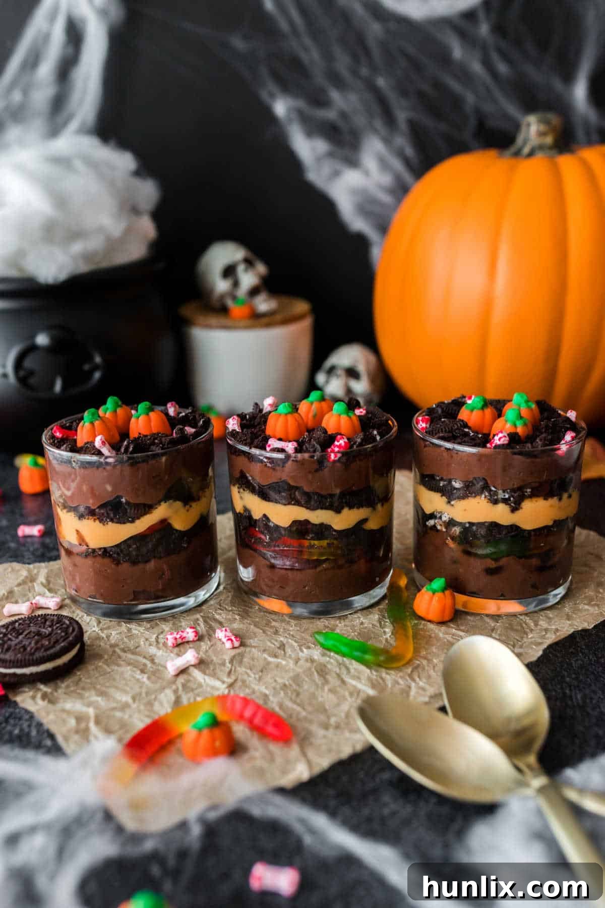 Pumpkin Patch Pudding Pots 7 Three pumpkin patch dirt cups lined up in a row.