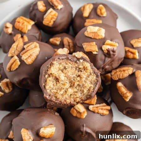 Pecan Pie Truffles 12 A group of the recipe on a plate.