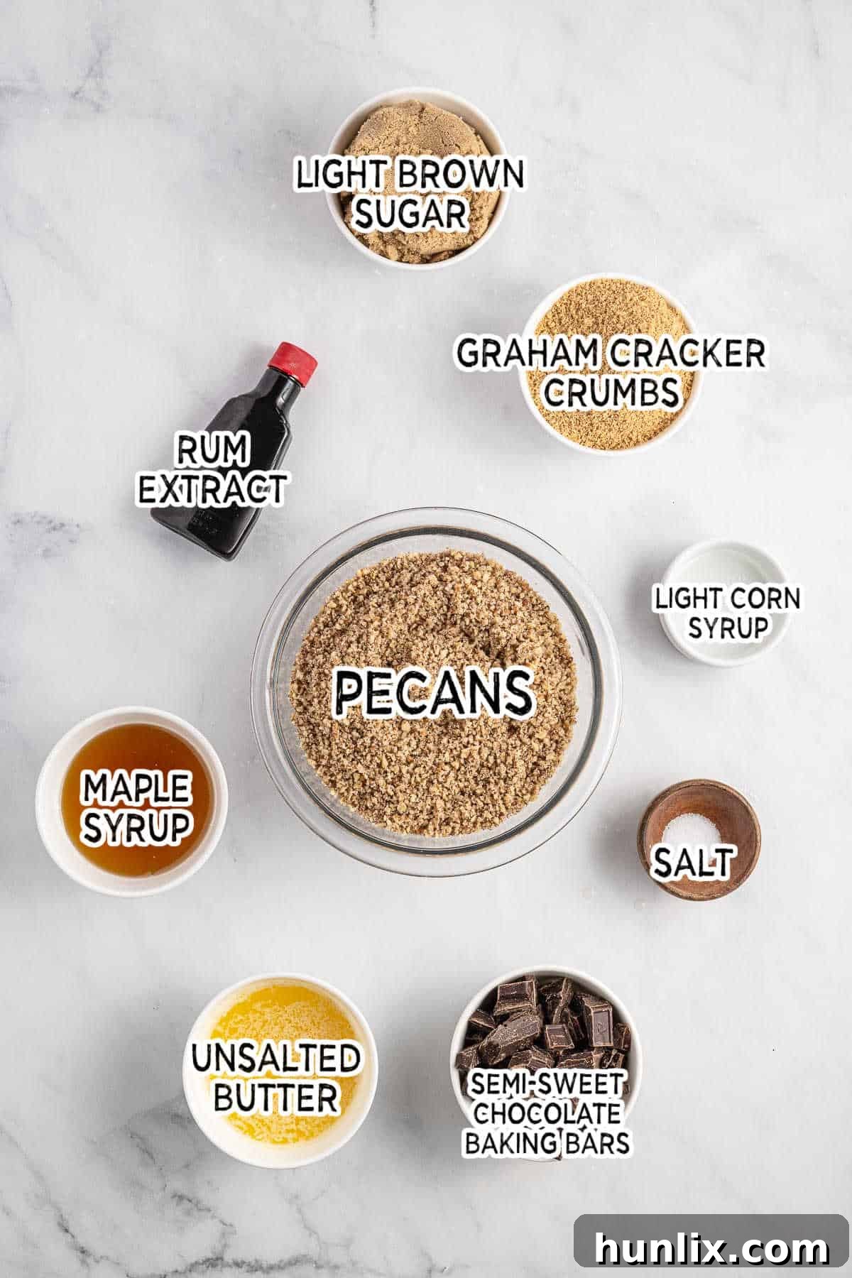 Pecan Pie Truffles 3 All the fresh ingredients for Pecan Pie Balls laid out neatly on a white marble background.