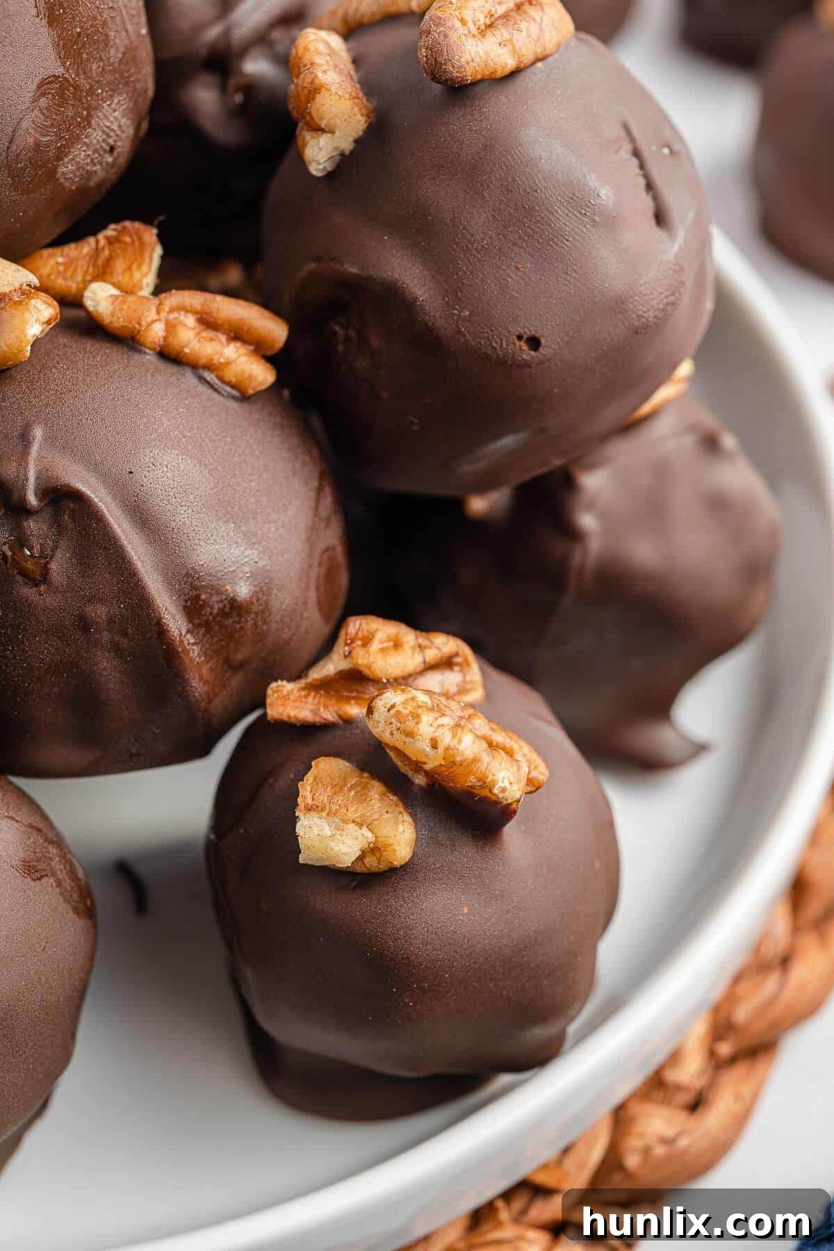 Pecan Pie Truffles 8 Beautifully arranged pecan pie balls on a festive serving plate, ready for guests.