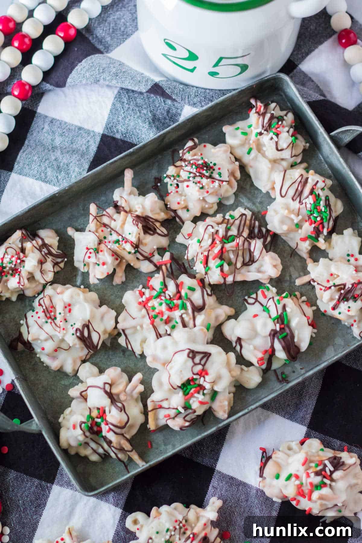 A baking sheet filled with perfectly set peppermint crockpot candy clusters, ready to be enjoyed or stored.