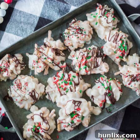 The finished peppermint crockpot candy clusters arranged on a baking sheet, showcasing their festive presentation.