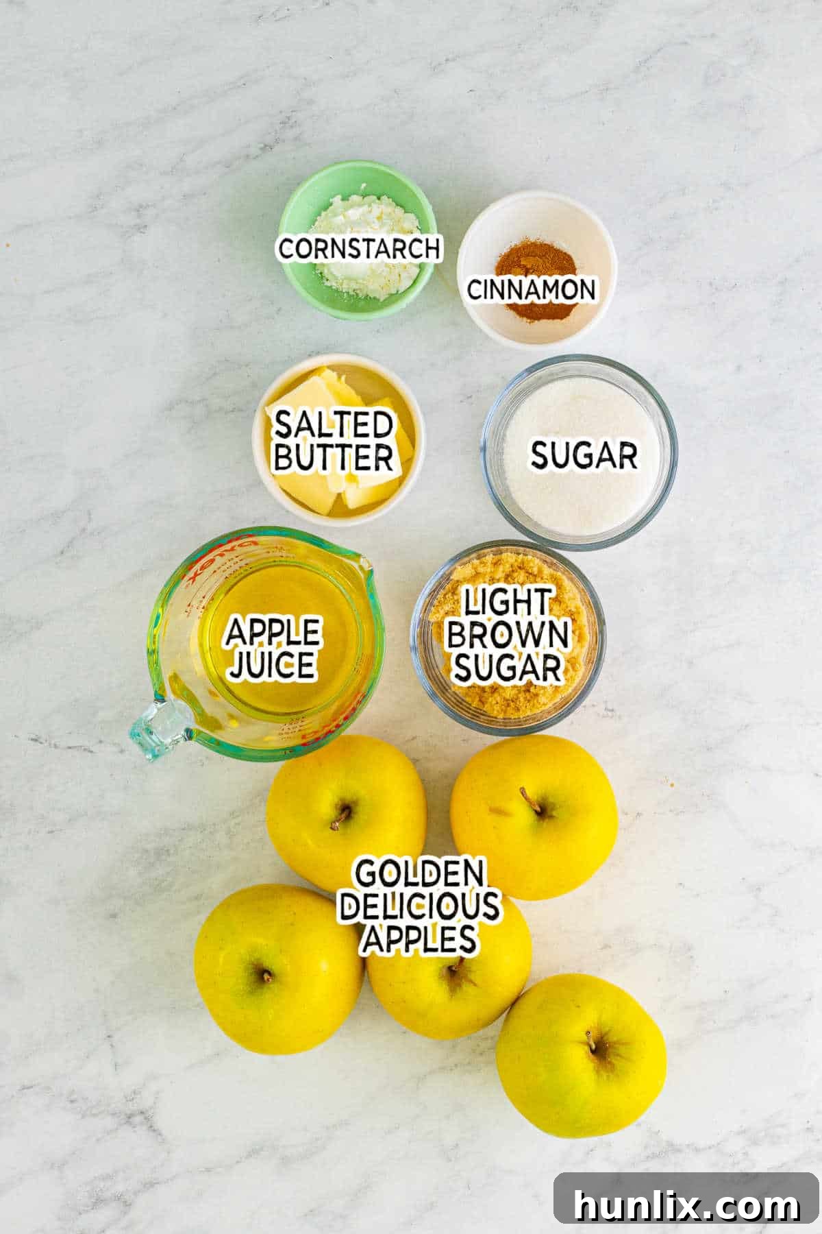 A selection of fresh ingredients, including apples, butter, and spices, laid out on a table, ready to be transformed into delicious copycat Cracker Barrel Fried Apples.