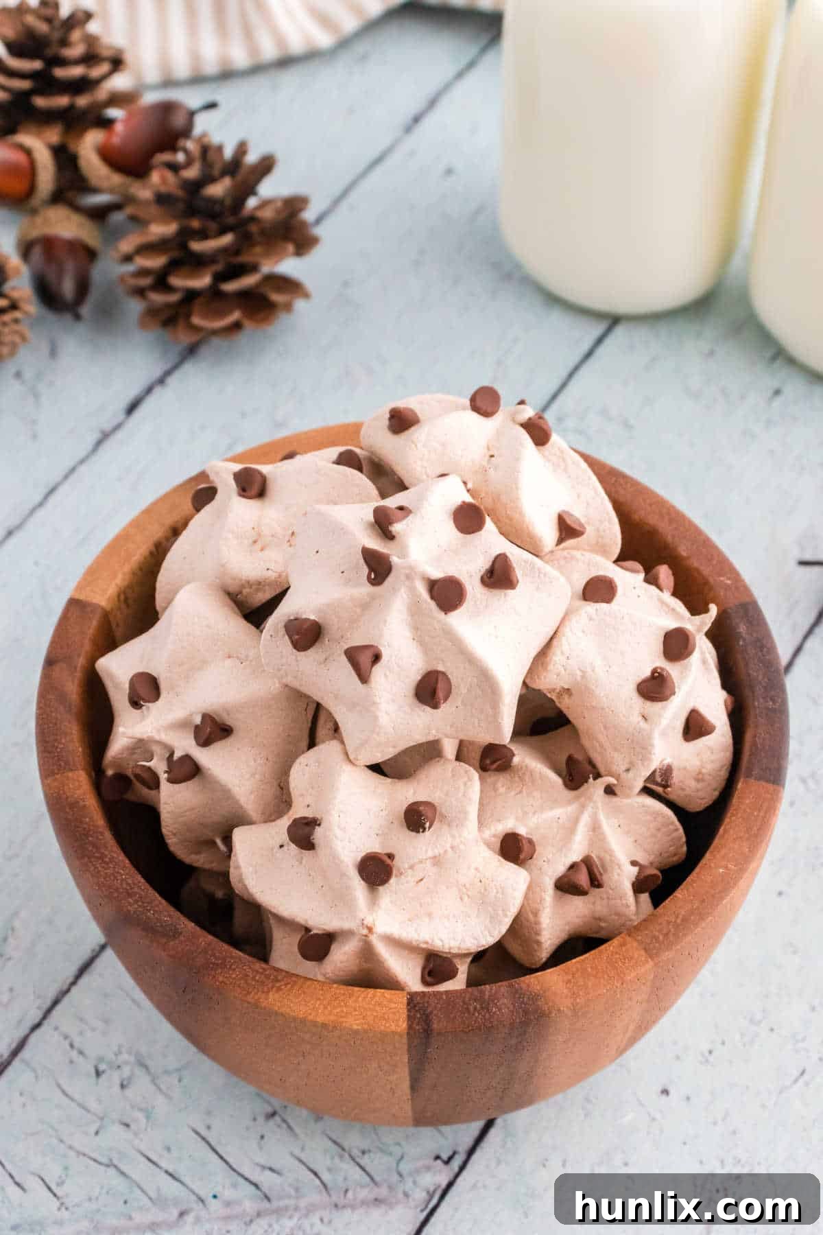 Decadent Double Chocolate Meringues 7 Double chocolate meringue cookies in a wooden bowl.