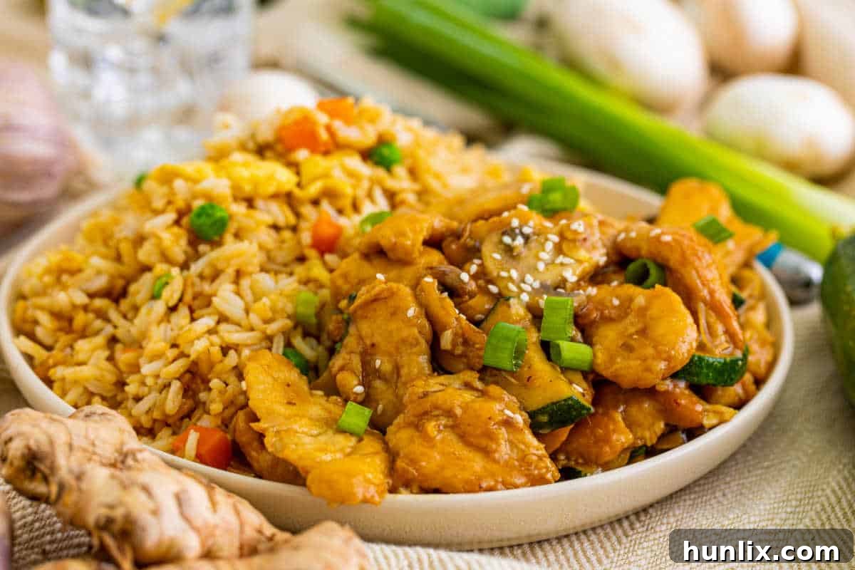 A plate of Panda Express Mushroom Chicken with fried rice.