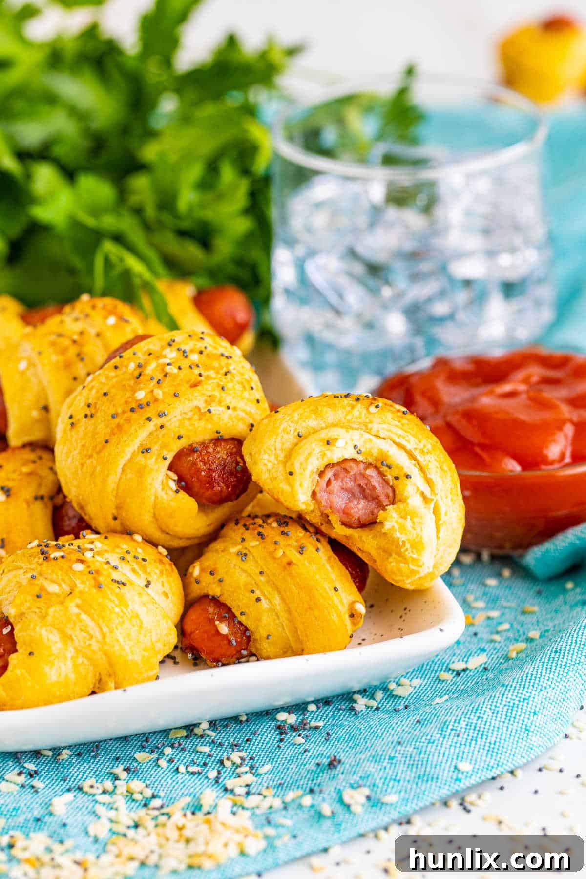 Snuggle Sausages 6 Pigs in a blanket on a platter.