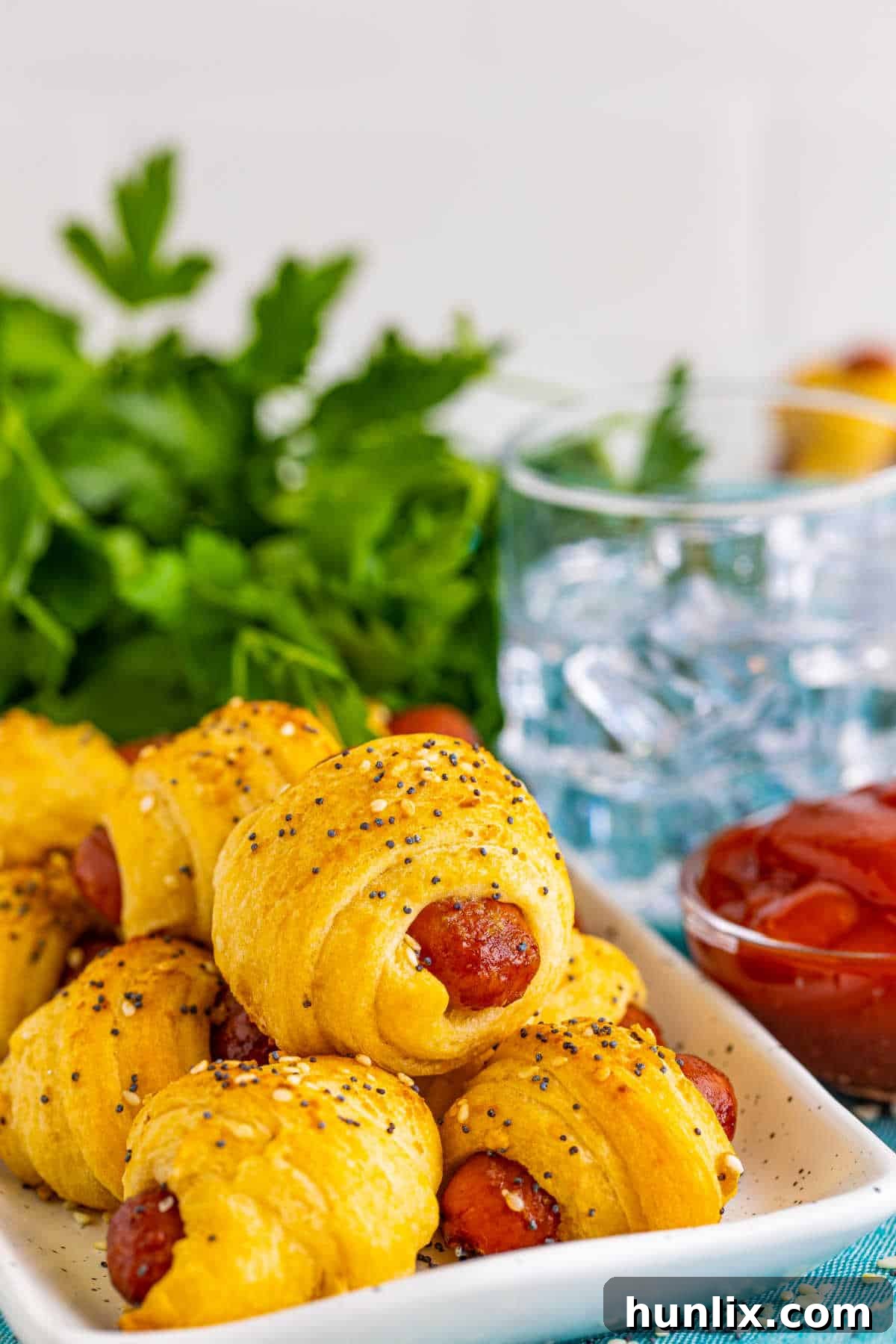 Snuggle Sausages 9 Pigs in a blanket on a platter.