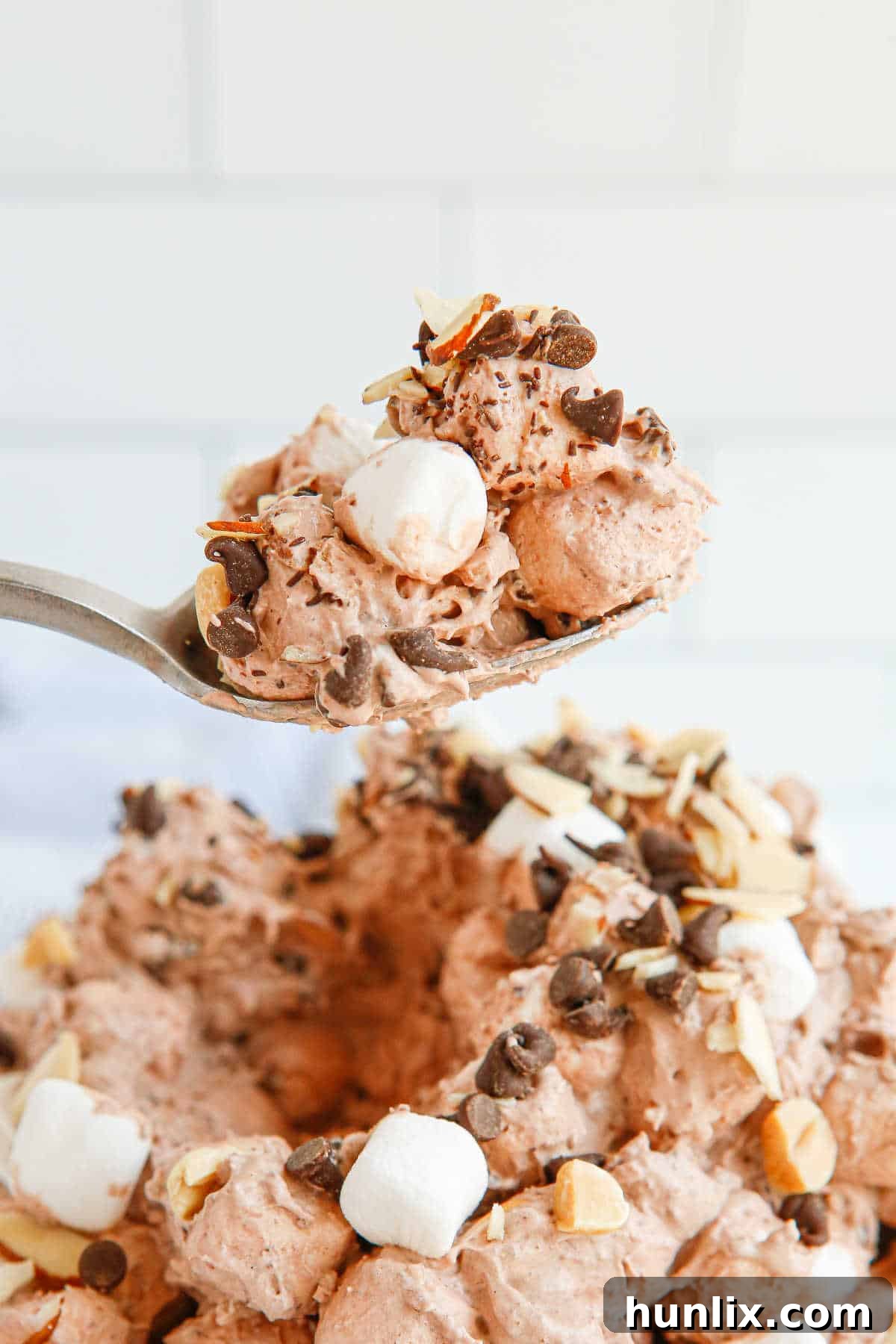 Decadent Rocky Road Dream 8 A spoon scooping a generous portion of Rocky Road Fluff, showing its readiness to be enjoyed.
