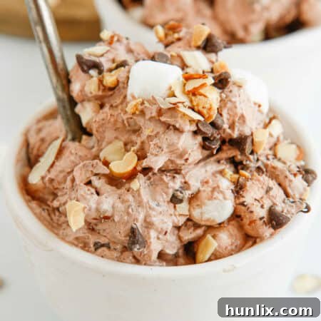 Decadent Rocky Road Dream 10 Delicious Rocky Road Fluff dessert, garnished with marshmallows and chocolate chips.