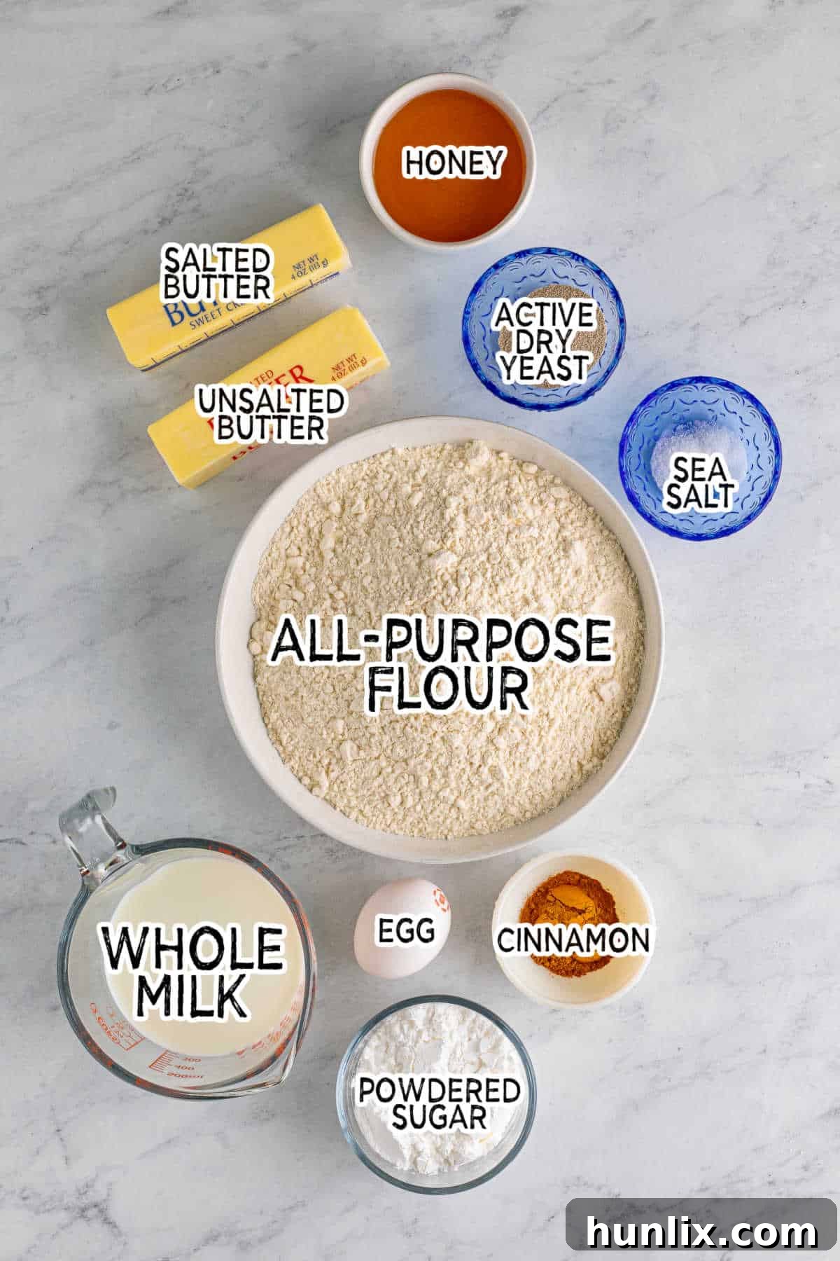 All the fresh ingredients laid out on a table, ready to be used for making Texas Roadhouse Rolls.