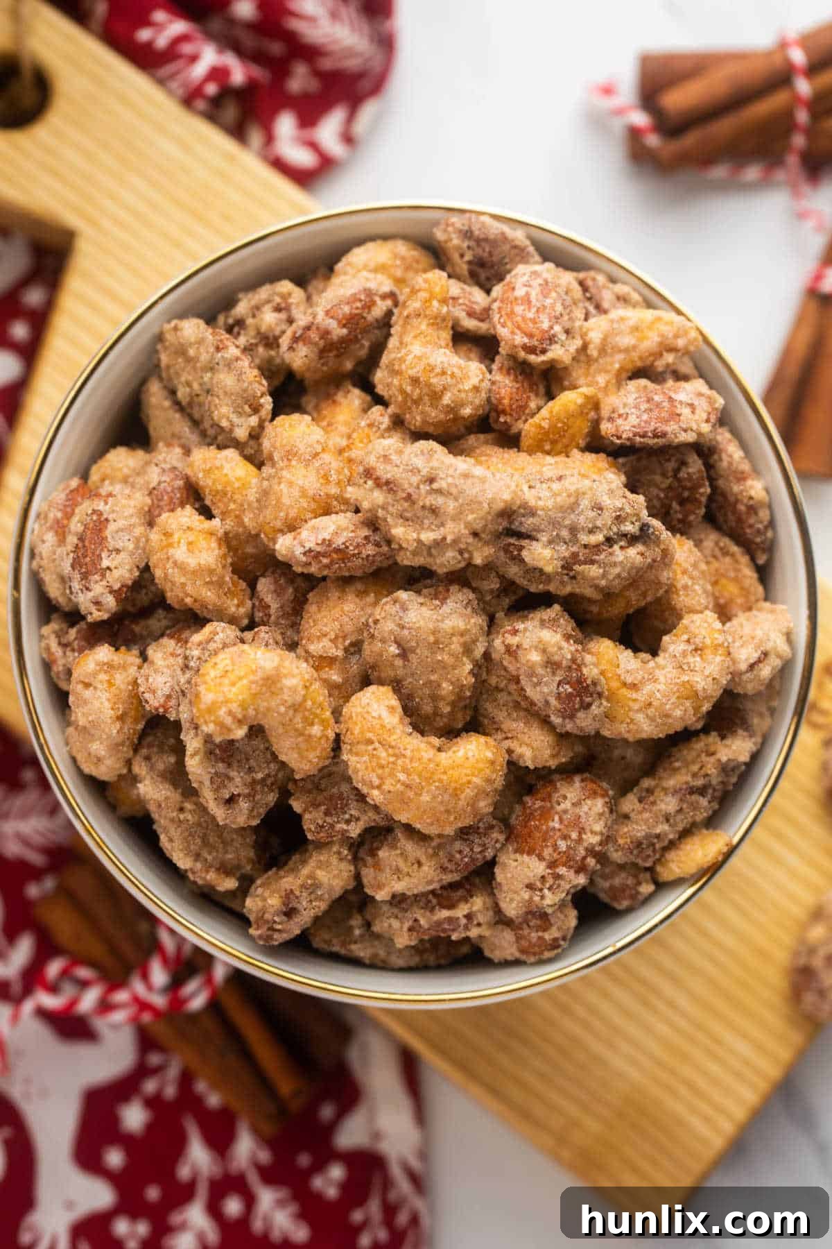 A rustic bowl filled with golden Crockpot Candied Nuts, ready to be enjoyed.