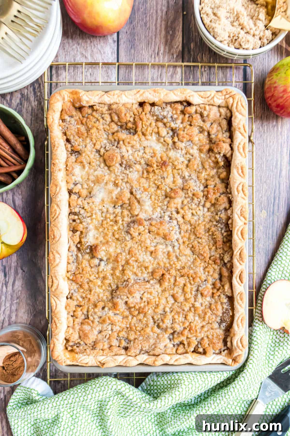 Sheet Pan Apple Pie 2 A large apple slab pie on a cooling rack, perfectly golden brown and inviting.