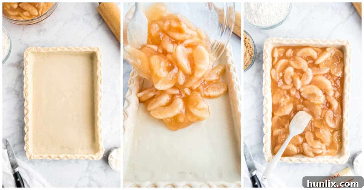 Sheet Pan Apple Pie 6 Image showing the apple pie filling being poured into the prepared pie crust in the sheet pan.