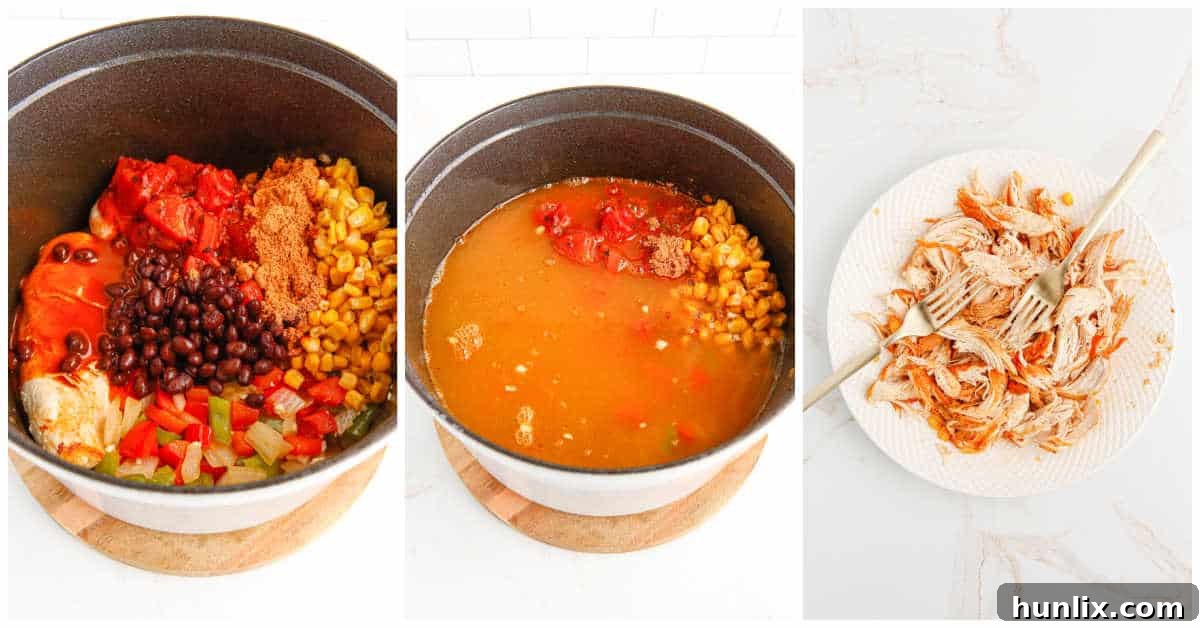 Close-up photo of a cooked chicken breast being shredded with two forks, ready to be returned to the soup.